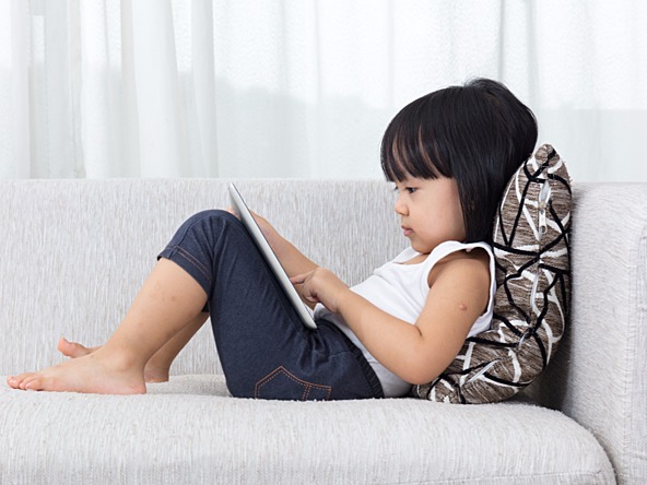 Child with tablet_crop